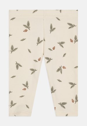 Cremefargede leggings med et heltrykk av grønne furugreiner og brune furukongler, laget av myk og elastisk stoff.