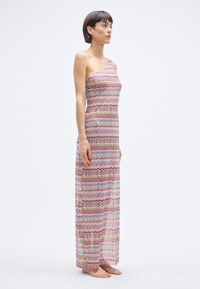 Maxikleit ühe õlaga, millel on mitmevärviline siksakmuster. Kerge, poolläbipaistev kangas langeb kuni pahkluudeni.