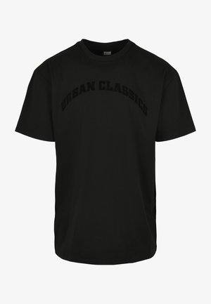 T-shirt en coton noir avec le logo "URBAN CLASSICS" en relief sur la poitrine. Coupe standard, manches courtes, col rond.