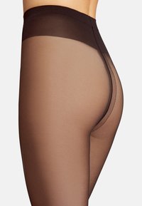 Sorte højtaljede gennemsigtige strømpebukser med en lys brun ufosset sektion, der har en glat tekstur og minimalt syninger langs kanterne.