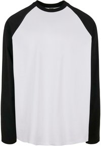 Langarm-Raglan-Shirt mit weißem Körper und schwarzen Ärmeln, aus weichem Baumwollstoff gefertigt, mit rundem Halsausschnitt und lässiger Passform.