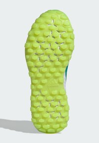 Semelle de chaussure d'une couleur jaune-vert vibrante, arborant un motif hexagonal pour l'adhérence. Inclut un accent blanc et un logo en relief.