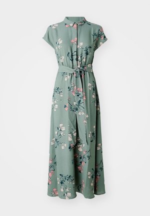 Green floral dress with short sleeves, collar, waist tie, and floral pattern in pink and blue. Flowy fabric, ankle-length design.