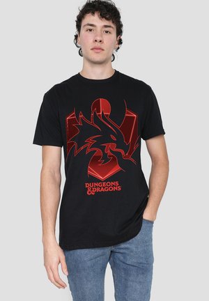 Black cotton t-shirt featuring a red dragon graphic and "Dungeons & Dragons" text at the bottom. Crew neckline and short sleeves.
