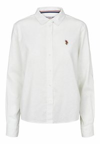 Vit långärmad skjorta med knappslå och krage, med en liten broderad polo-spelare logotyp på vänster bröst.