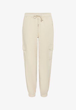 Beżowe spodnie cargo z elastycznym pasem, ściągaczem i kieszeniami bocznymi. Wykonane z lekkiego materiału o gładkiej fakturze.
