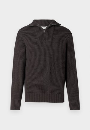 Tmavě šedý pletený pulovr se zipem do půlky a dlouhými rukávy. Má žebrovanou texturu, boxy střih a strukturovaný design.