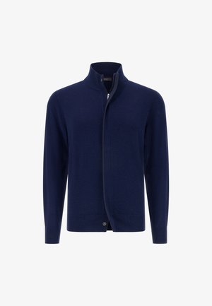 Cardigan lavorato a maglia blu navy con colletto alto, maniche lunghe e zip frontale. Presenta polsini a coste e un bottone all'orlo.