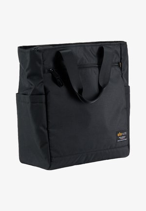 Zwarte stof draagtas met een ritssluiting aan de bovenkant, dubbele handvatten en zijzakken. Heeft een klein logo en een gestructureerd oppervlak.