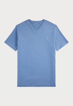 Kortärmad, ljusblå V-ringad t-shirt av bomull, med en liten broderad logotyp i guld på vänster bröst.