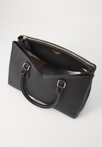 Black synthetic handbag with gold zipper and hardware. Features dual top handles, structured shape, and a fabric-lined interior.