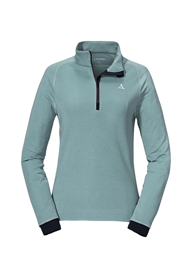 Světle modrý pulovr s čtvrtinovým zipem, dlouhými rukávy a námořnickými manžetami. Obsahuje kontrastní švy a logo na prsou.