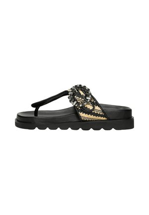 Sandali neri flat con suola testurizzata, dotati di una fascia decorativa in tessuto con un accento di perle e un design intrecciato in tonalità beige.