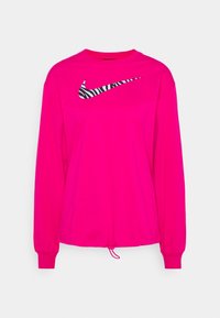 Rosa långärmad skjorta med en svart och vit zebra-randig Nike-logga. Har en dragsko i fållen och ribbade muddarna. Mjuk tygtextur.