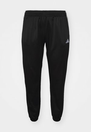 Black athletic pants made from lightweight fabric, featuring an elastic waistband, tapered legs, and a small logo on the left thigh.