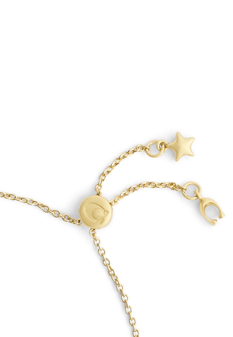 Goldarmband mit einer zarten Kette, rundem Verschluss mit graviertem Logo und einem Sternanhänger an einem Ende, der ein einfaches, aber elegantes Design zeigt.