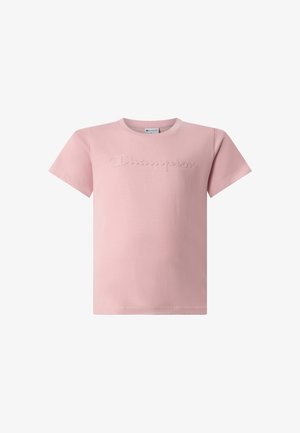 T-shirt rose à manches courtes avec logo Champion embossé sur la poitrine et encolure ronde.