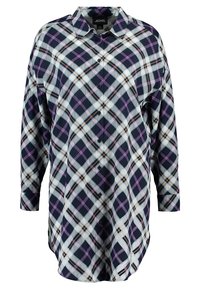 Camicia a maniche lunghe a quadri in blu navy, bianco e viola con chiusura a bottoni e colletto. Tessuto morbido con vestibilità rilassata.