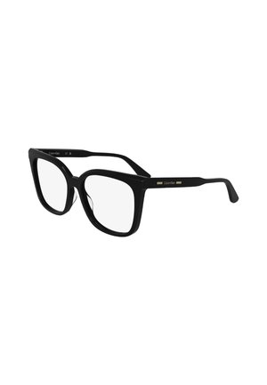 Occhiali oversized neri con una montatura in plastica spessa, dotati di lenti trasparenti e un accento dorato sulla stanghetta, forma angolare e texture liscia.