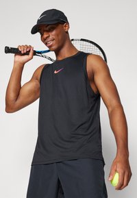 Nike Performance COURT SLAM TANK  - Top - black/light wild mango
