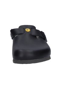 Schwarze Clogs zum Hineinschlüpfen mit abgerundetem Zehenbereich, zwei verstellbaren Riemen und einem gelben Logoakzent. Hergestellt aus glattem Material mit einer stabilen Sohle.