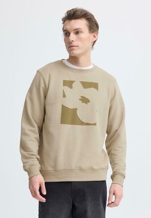 Beige bomuldssweatshirt med brunt abstrakt grafisk design foran, ribbet ærmekanter og rund halsudskæring.