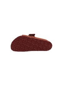 Brown suede slipper with a textured rubber sole, featuring a wavy pattern and an adjustable strap for secure fit.