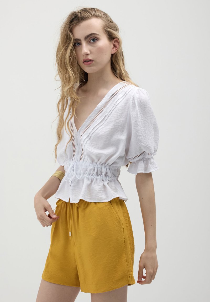 Calliope Pantaloni sportivi - giallo