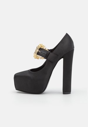 Højhælede pumps - black
