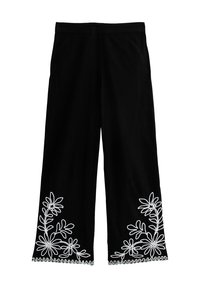 Svarta vida byxor med vitt blommönster broderat vid fållen. Tillverkade av mjukt tyg och har ett enkelt res�årmidja.