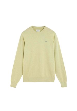 Jersey de cuello redondo, manga larga, de color amarillo claro con pequeño logo negro de calavera y huesos cruzados en el pecho izquierdo.