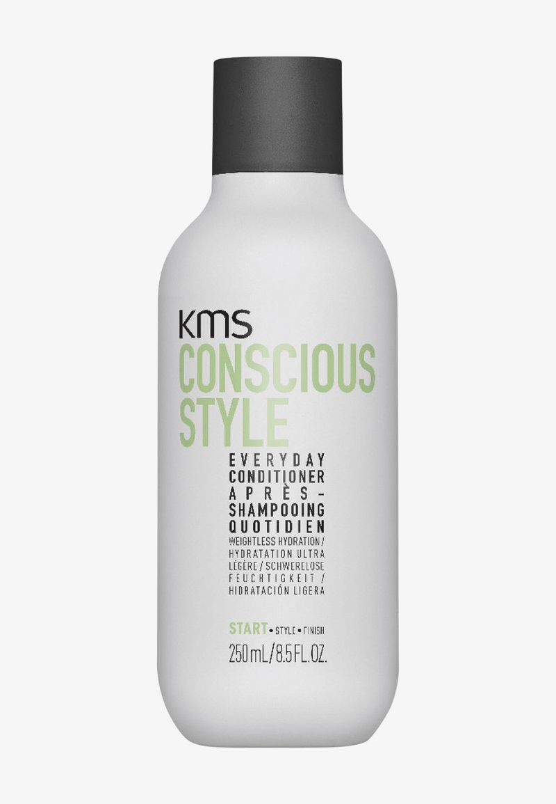 Flacon blanc de KMS Conscious Style Everyday Conditioner avec bouchon noir, 250 ml, étiqueté pour une hydratation légère et une faible humidité.