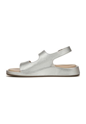 Silver leather sandal with an open toe, a curved midsole, and a back strap. Features a smooth texture and a low wedge design.