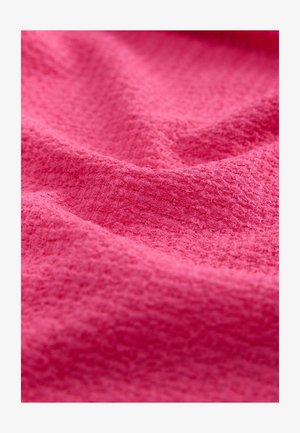 Kergelt tekstureeritud kangas erkkollases, kerge kortsus, pehme ja пухлый tunne. Pind näitab väikseid, ebatasaseid mustreid. Kerge ja paindlik.