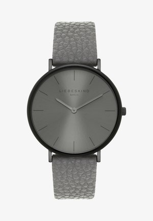 Analog watch with a matte gray face and black stainless steel case; features a textured light gray leather strap and minimalist black hour markers.
