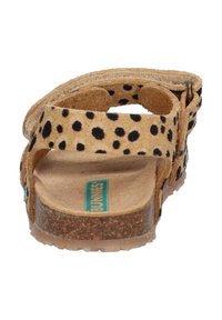 Tanfarbene Wildledersandalen mit schwarzen Punkten, Korksohle, verstellbarem Riemen und Gummi-Ausgang. Verfügt über eine strukturierte Innensohle für besseren Halt.