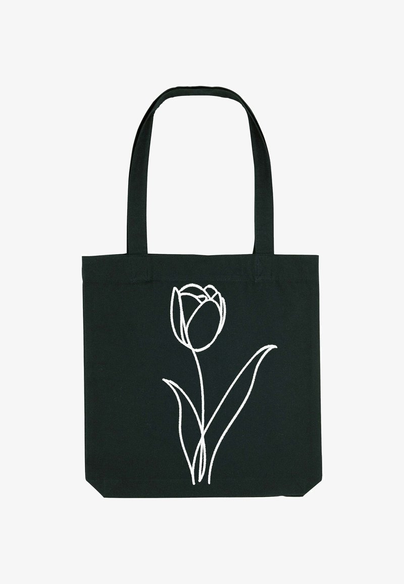 Zwarte tote bag met lange handvatten, voorzien van een eenvoudige witte lijntekening van een enkele tulp met twee bladeren aan de voorkant.