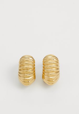 Gold-tone hoop earrings with a ribbed texture, featuring a rounded shape and polished finish, creating a reflective surface.