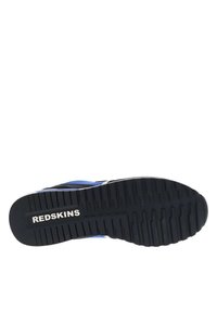 La suola della scarpa presenta un materiale gommoso nero con profonde scanalature. Accenti blu e bianchi lungo il lato, con il logo "REDKINS" ben visibile.