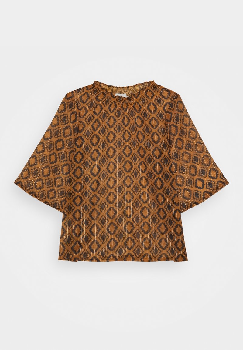 Blouse marron avec motif géométrique en losange noir, manches larges trois-quarts et encolure froncée.