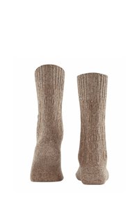 Brązowe wełniane skarpetki z ściągaczem, ozdobione fakturowanym wzorem i gładkim wykończeniem, zaprojektowane z myślą o komforcie i cieple.