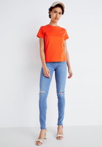 Levi's® Tričko s potlačou - orange