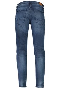 Jeans ajustados de denim azul, con una textura suave, diseño de cinco bolsillos y un acabado ligeramente desgastado en las piernas y la parte trasera.