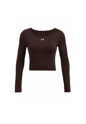 Pruun pikkade varrukatega lühike topp, mis on valmistatud siledast kangast, ümmarguse kaelusega ja kerge valge logoga rinnal.
