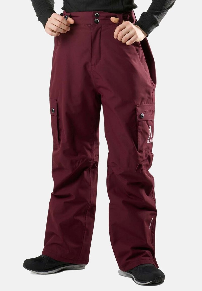 Pantaloni da neve bordeaux realizzati in materiale resistente, dotati di due tasche frontali, chiusura con bottone e vestibilità comoda per facilitare i movimenti.