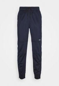 Navyfärgade joggers med texturerad tyg, elastisk midja och justerbar dragsko, tapered passform och dragkedjeaccent vid ankeln.