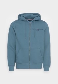 Sudadera azul con cremallera, fabricada en una suave mezcla de algodón, con un logo en el frente, capucha con cordón y bolsillos tipo canguro. Puños y bajo de canalé.