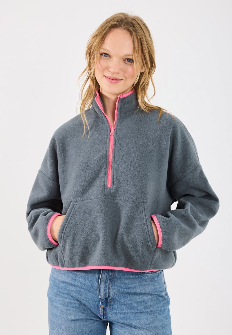 Gray fleece pullover with a quarter-zip and pink accents, featuring a front pocket and contrast trim at the cuffs and hem.