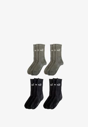 Four pairs of socks, two in dark gray with ribbed texture and logo, two in black with smooth texture and logo, all mid-calf length.