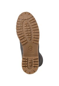 Suela de bota con un fondo de goma texturizada y profundas ranuras de tracción. El color marrón claro contrasta con el material superior oscuro.